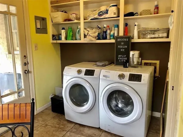 a utility room with dryer and washer