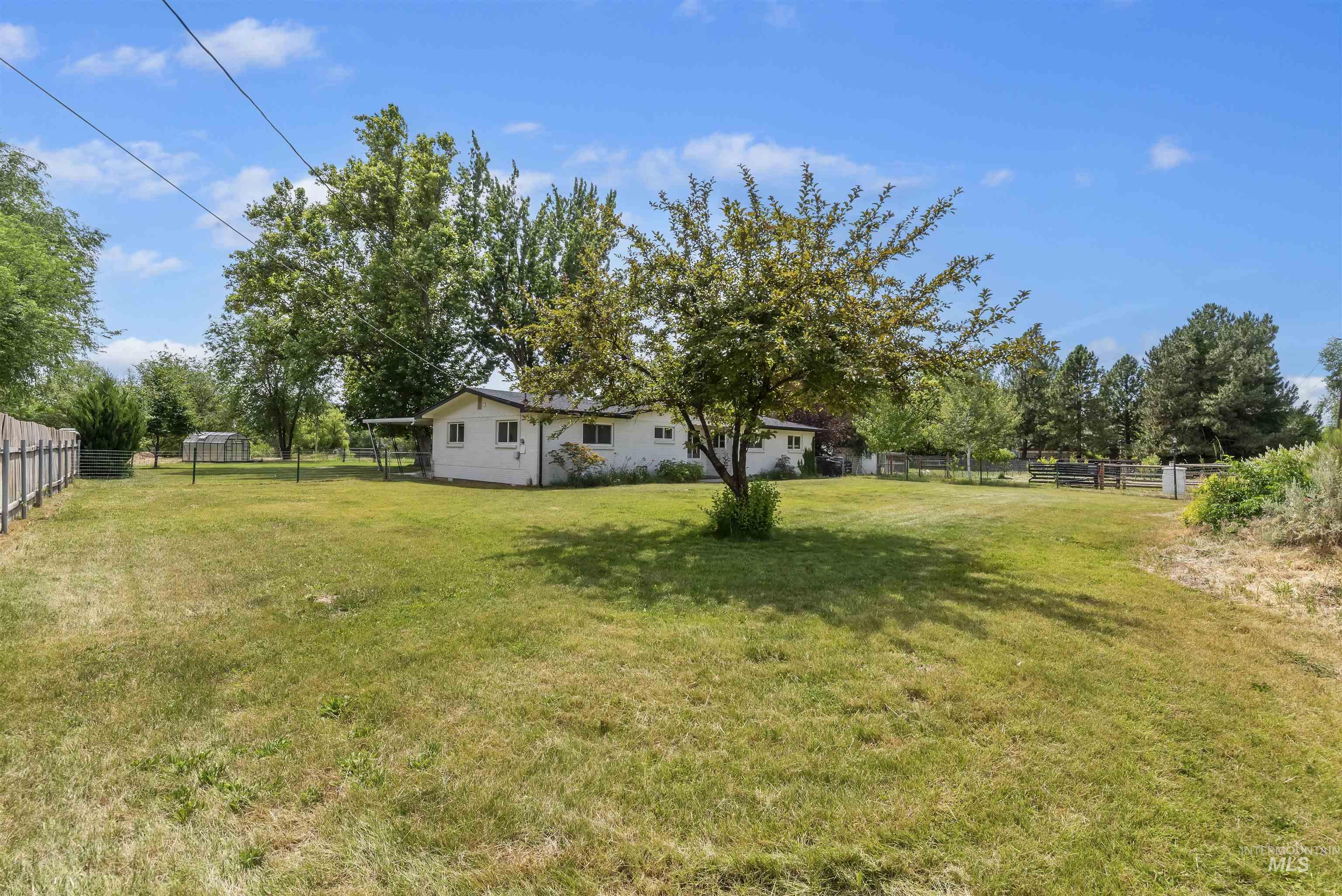 355 East Beacon Light Road Eagle, ID 83616 - Photo 35 of 47 Expansive grassy yard with mature trees