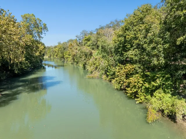 a view of lake with green space