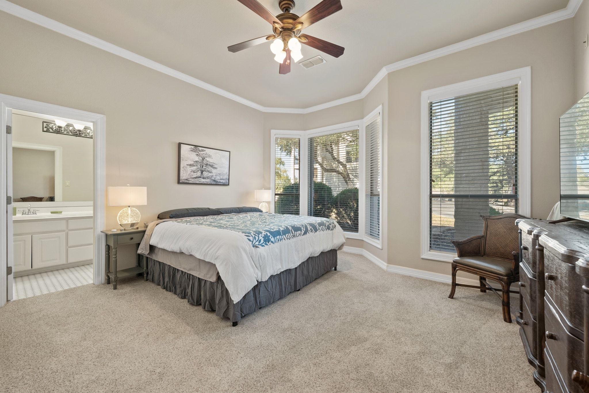 185 Shimmering Shore Court Spring Branch, TX 78070 - Photo 19 of 36 Bedroom featuring light carpet, ceiling fan, crown molding, and ensuite bathroom