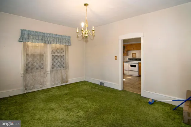 a view of a room with windows and chandelier