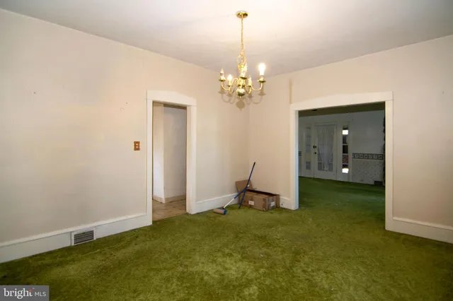 a view of a hallway with a window