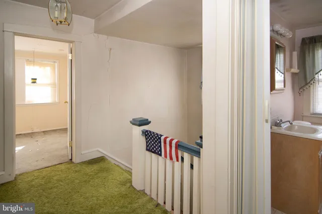 a view of a room with a hallway