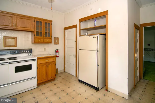 a kitchen with a stove a sink and a microwave