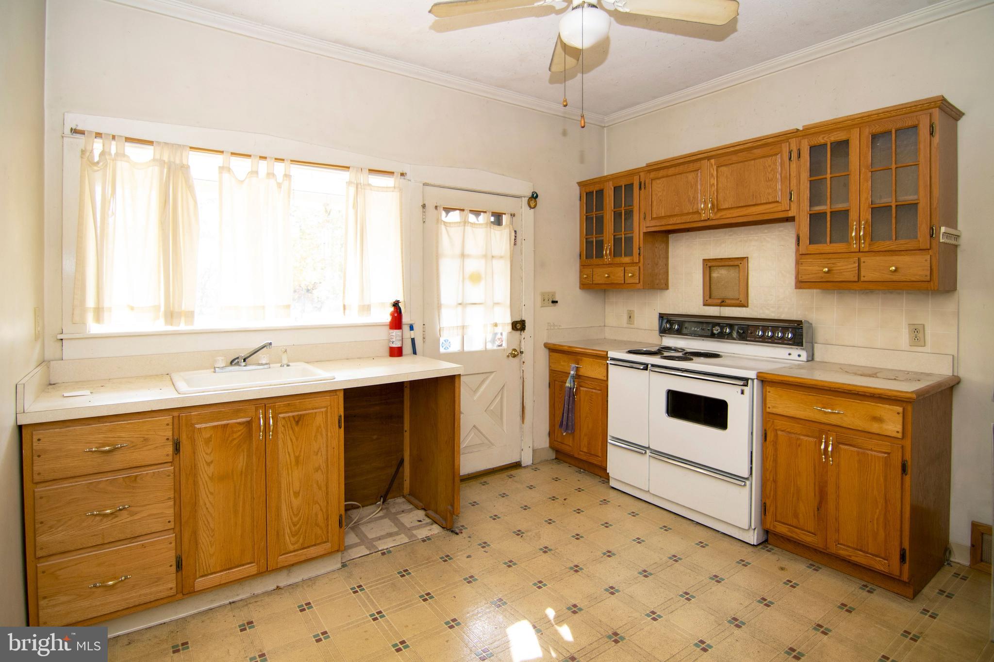 542 Williamstown Road Sicklerville, NJ 08081 - Photo 10 of 38 a kitchen with a stove a sink and a microwave