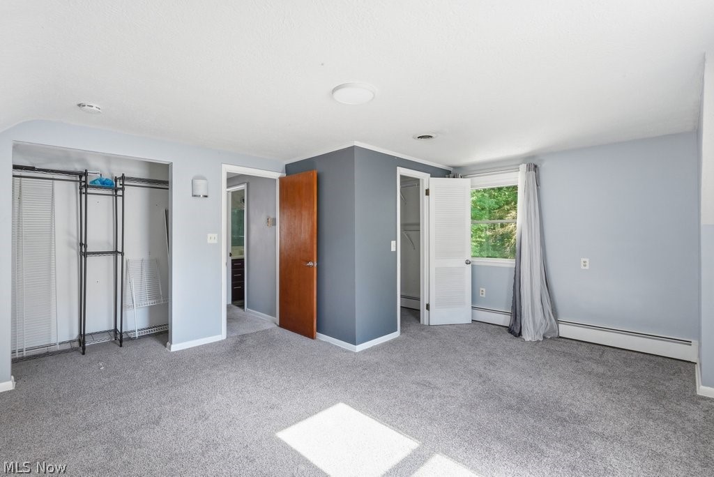 136 Pinehurst Road Munroe Falls, OH 44262 - Photo 24 of 48 Carpeted interior space with light blue walls and a contrasting dark grey accent wall