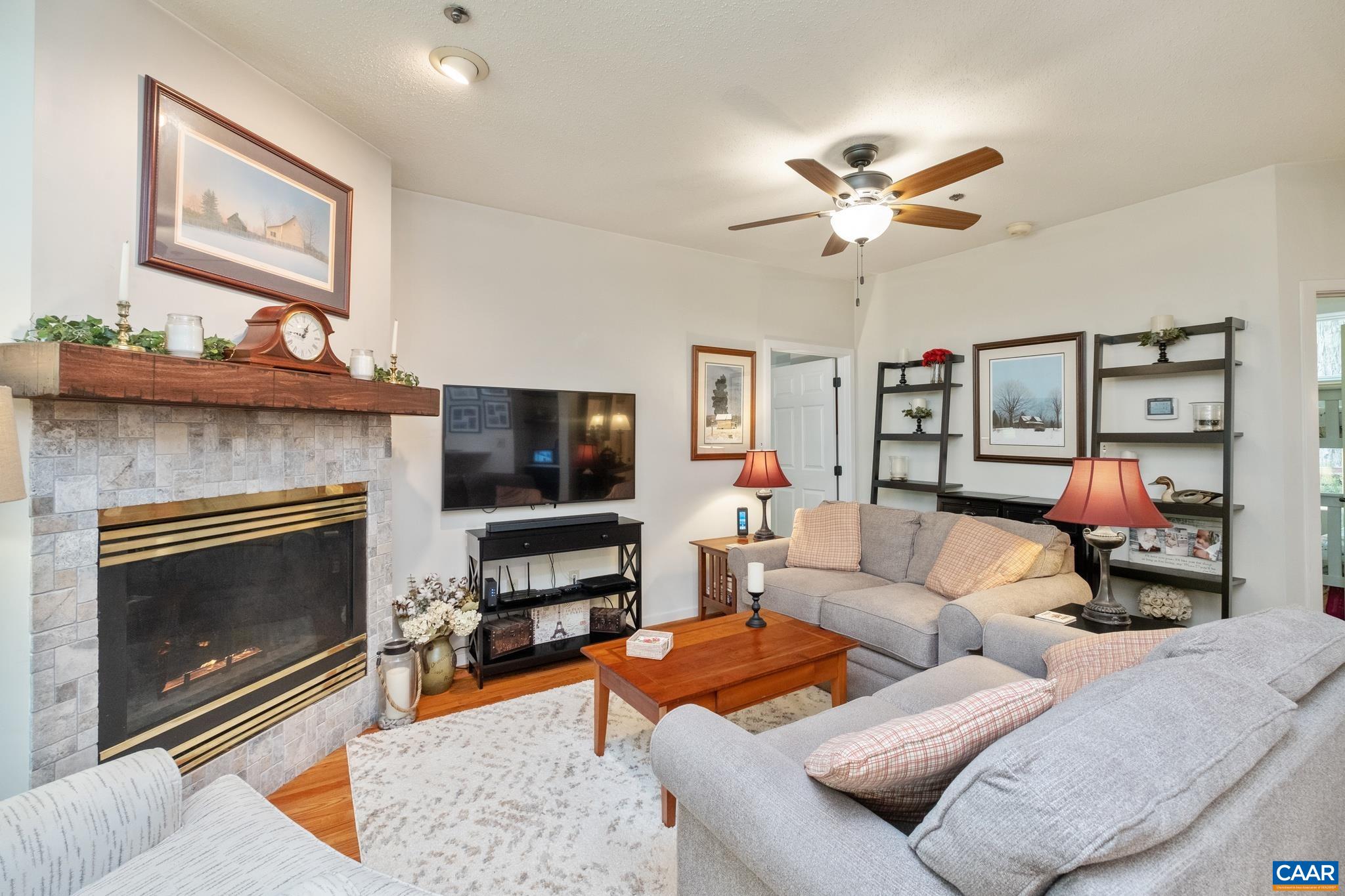 2003 Stone Rdg Wds Roseland, VA 22967 - Photo 2 of 29 a living room with furniture a flat screen tv and a fireplace