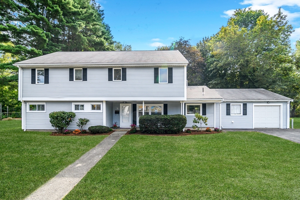 9 Liberty Street Natick, MA 01760 - Photo 1 of 27 a front view of a house with a garden and yard
