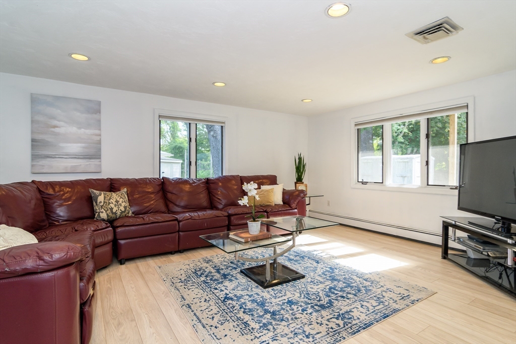 9 Liberty Street Natick, MA 01760 - Photo 12 of 27 a living room with furniture and a window