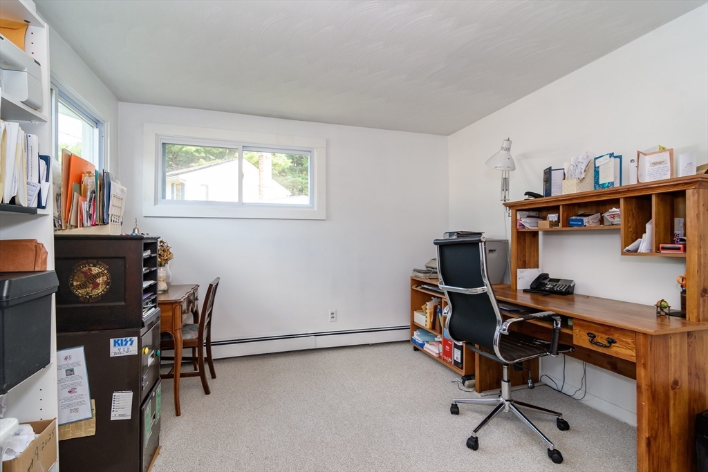 9 Liberty Street Natick, MA 01760 - Photo 13 of 27 a view of a workspace with furniture and a window
