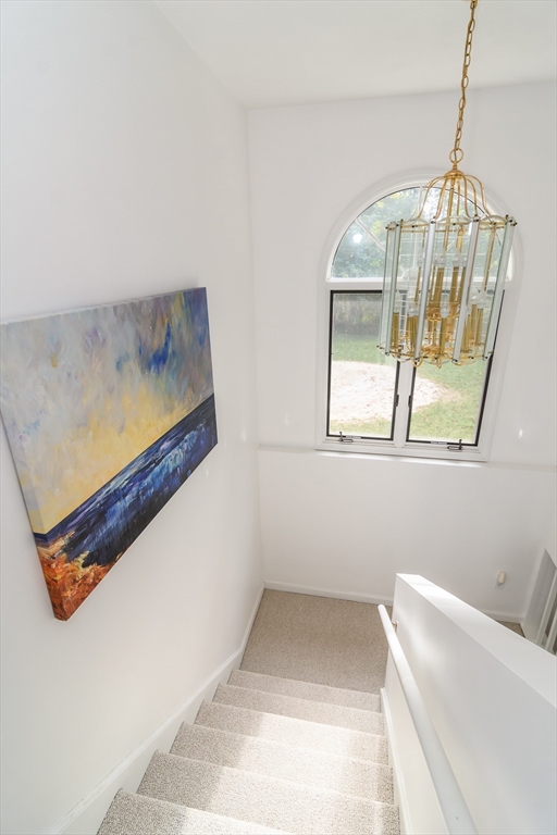 9 Liberty Street Natick, MA 01760 - Photo 15 of 27 a bathroom with a bathtub and a window