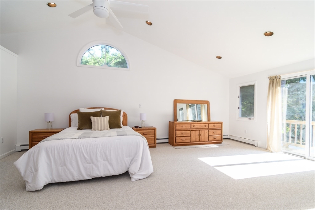 9 Liberty Street Natick, MA 01760 - Photo 16 of 27 a bedroom with a bed and a chandelier