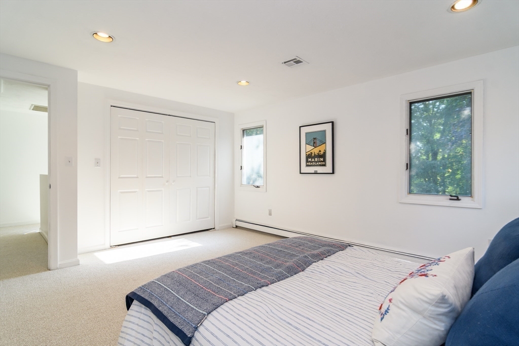 9 Liberty Street Natick, MA 01760 - Photo 20 of 27 a bedroom with a bed and a window