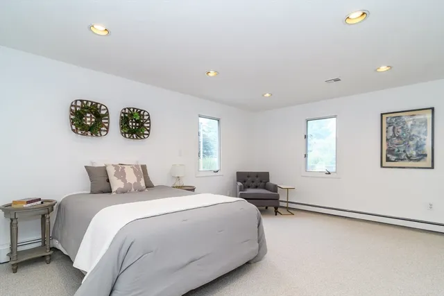 a bedroom with a bed and a desk