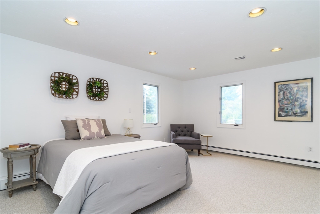 9 Liberty Street Natick, MA 01760 - Photo 21 of 27 a bedroom with a bed and a desk