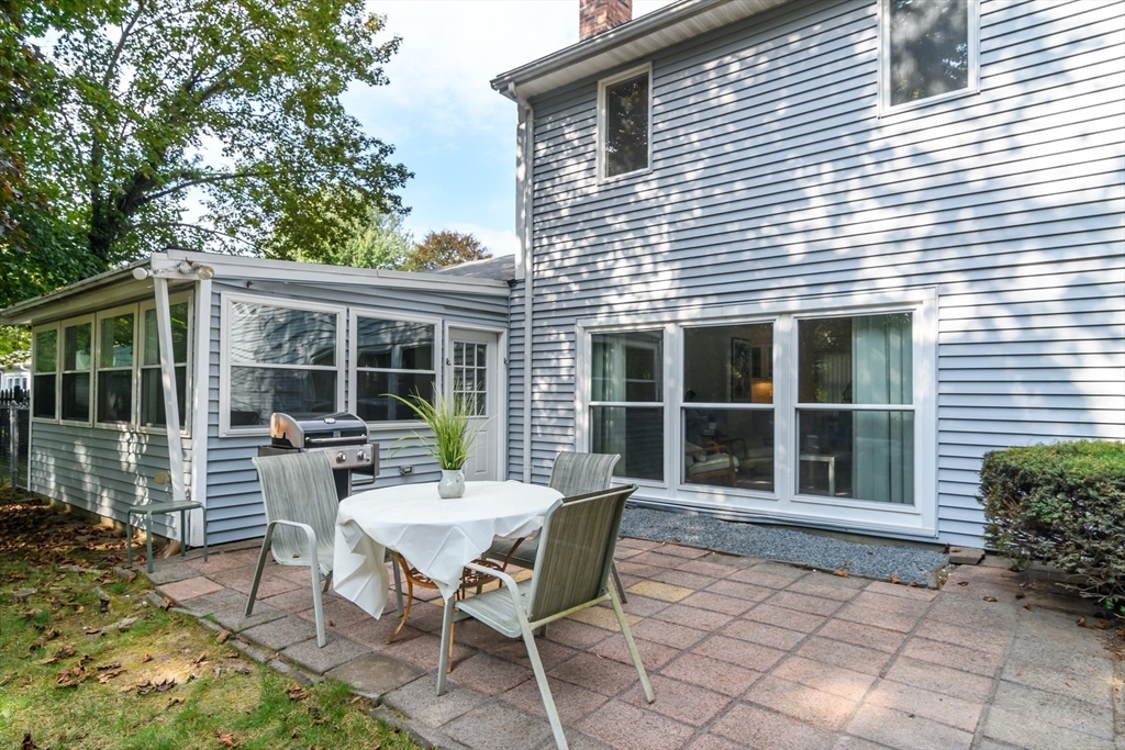 9 Liberty Street Natick, MA 01760 - Photo 24 of 27 a view of a house with backyard and sitting area