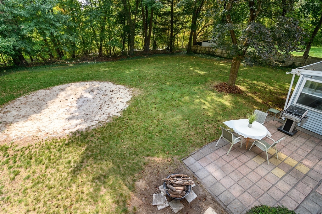 9 Liberty Street Natick, MA 01760 - Photo 25 of 27 a view of a backyard with sitting area