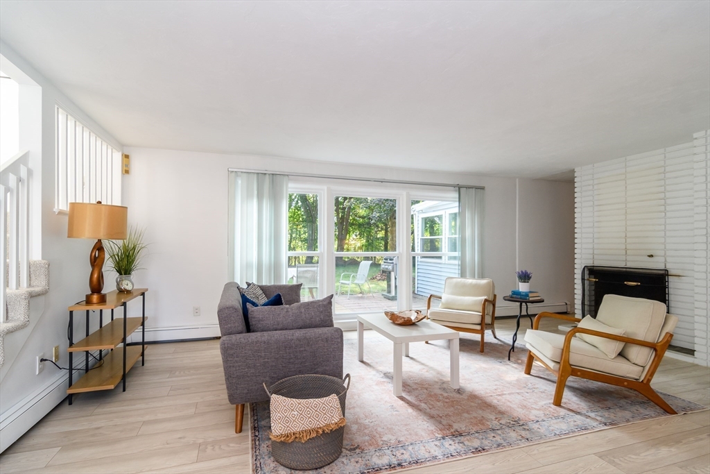 9 Liberty Street Natick, MA 01760 - Photo 3 of 27 a living room with furniture and a fireplace