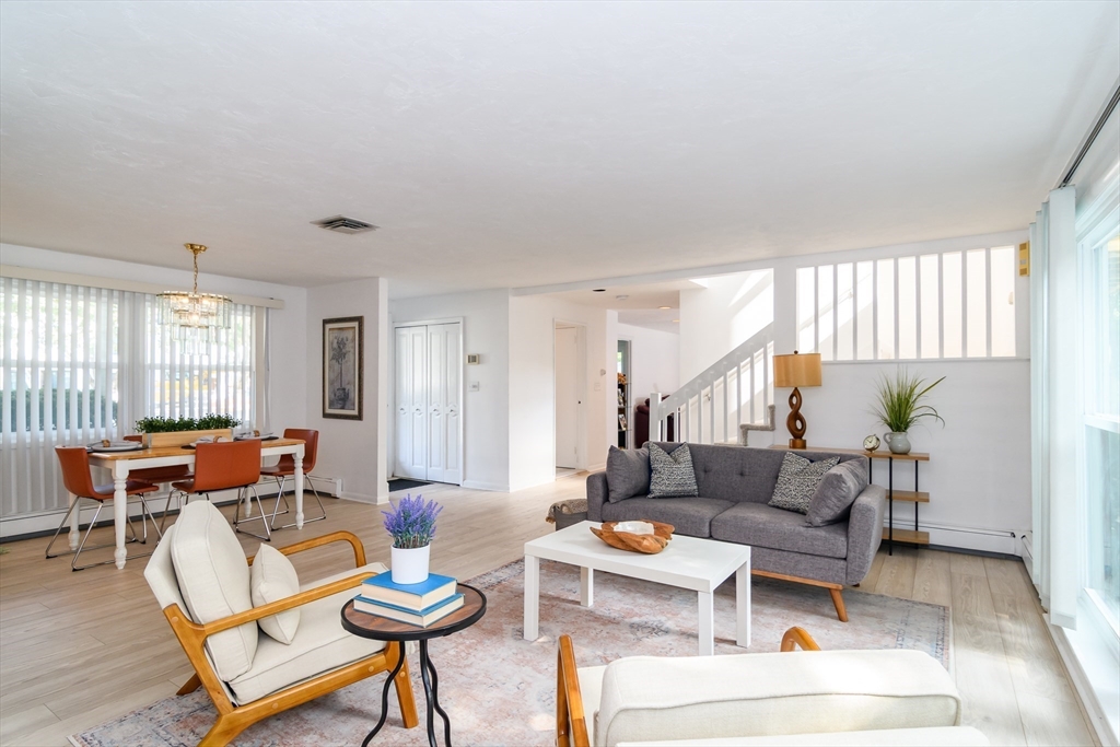 9 Liberty Street Natick, MA 01760 - Photo 4 of 27 a living room with furniture and a large window
