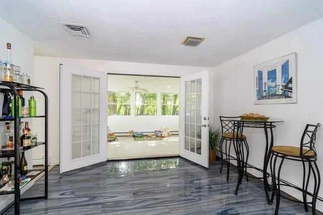 a view of a livingroom with furniture and a window