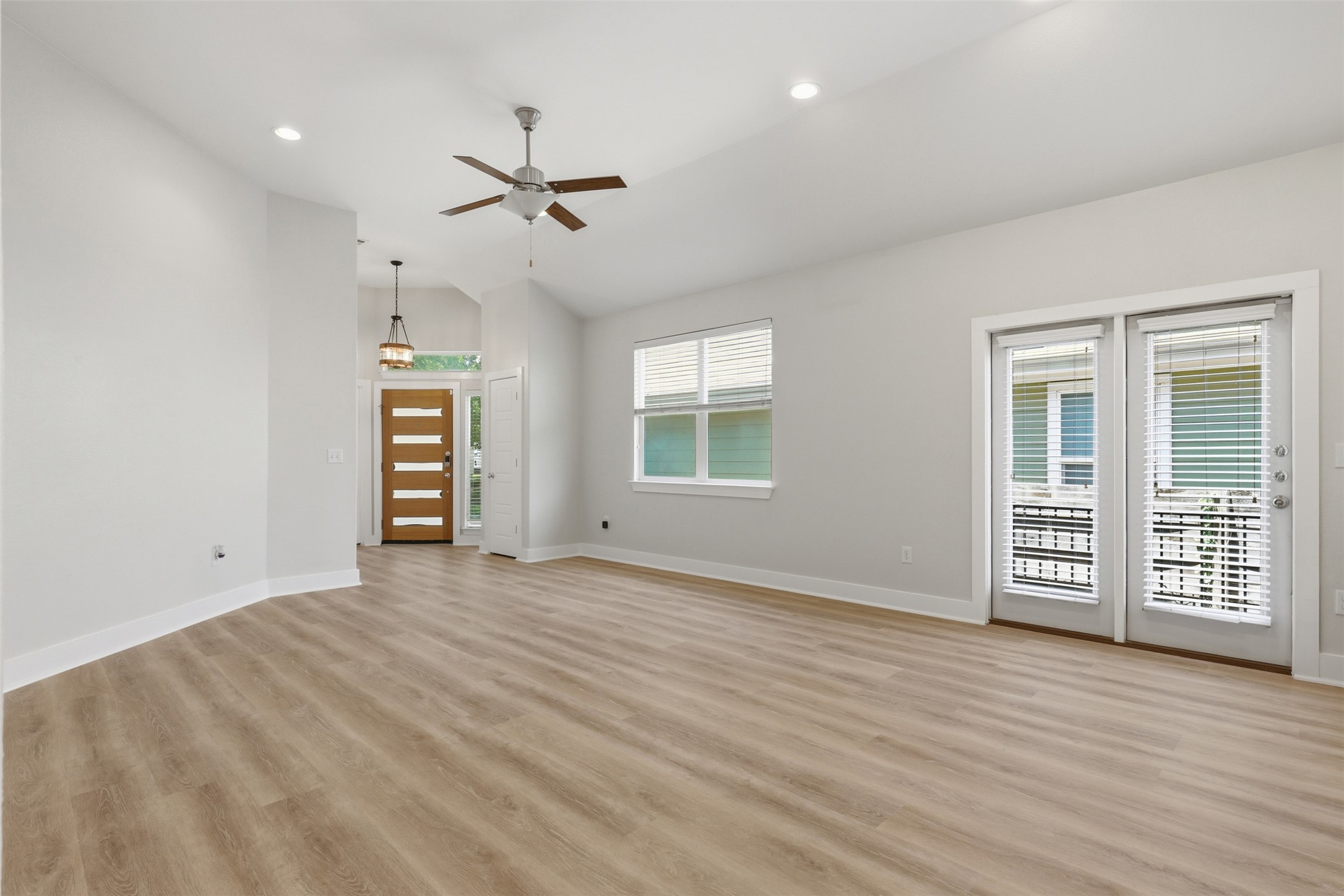 7208 Lysander Court Austin, TX 78741 - Photo 4 of 15 wooden floor in an empty room with a window