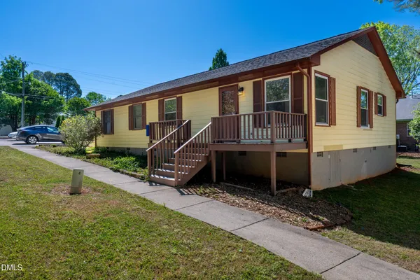 front view of a house with a yard