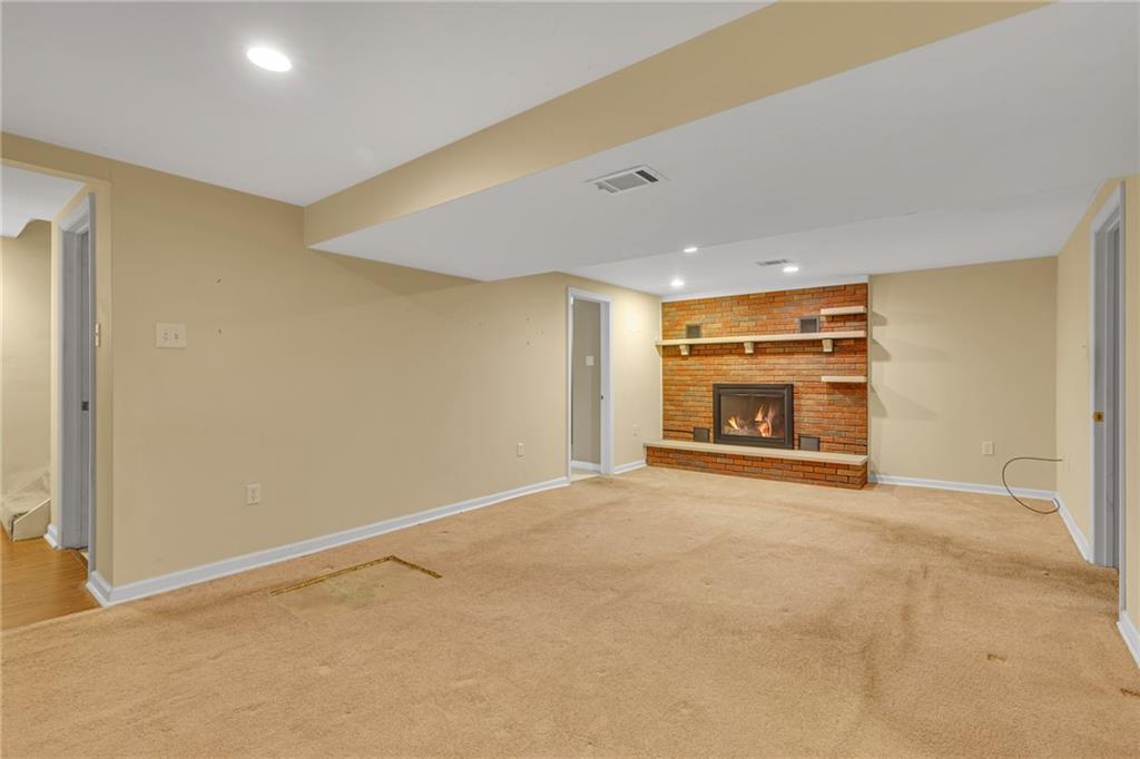 142 Wickham Drive Monaca, PA 15061 - Photo 15 of 26 a view of an empty room with a fireplace and a window