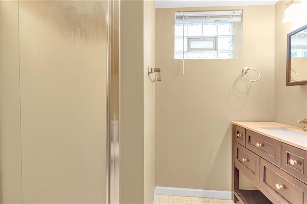 142 Wickham Drive Monaca, PA 15061 - Photo 17 of 26 a bathroom with a window and a shower