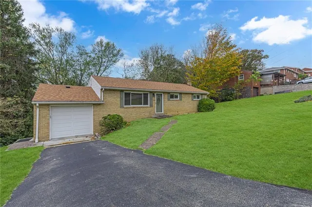 a view of house with outdoor space and yard