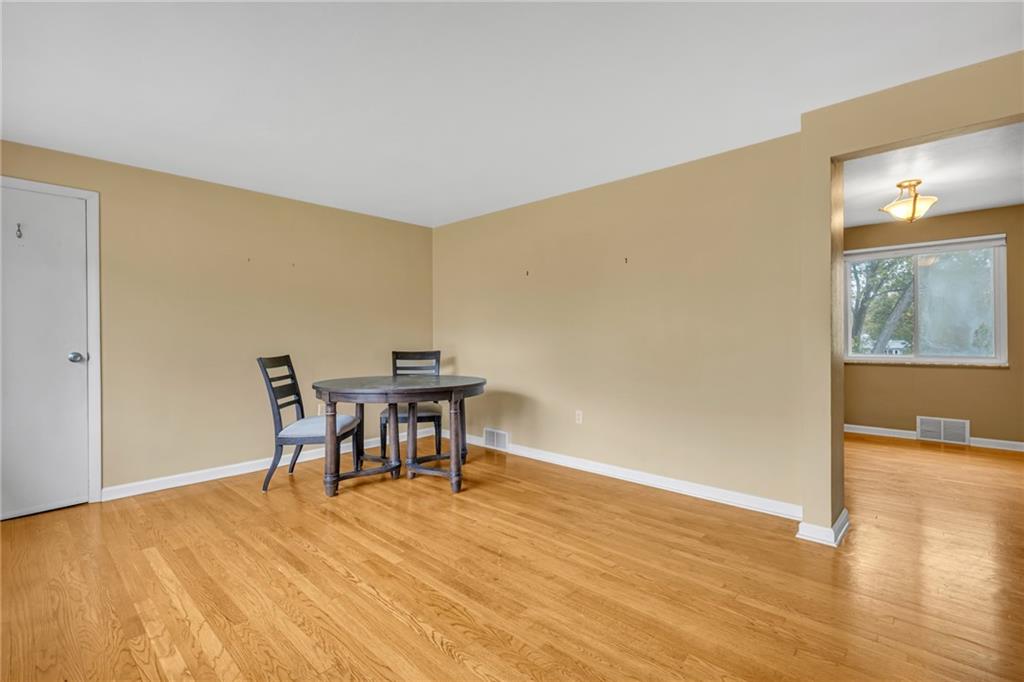 142 Wickham Drive Monaca, PA 15061 - Photo 3 of 26 a workspace with furniture and wooden floor