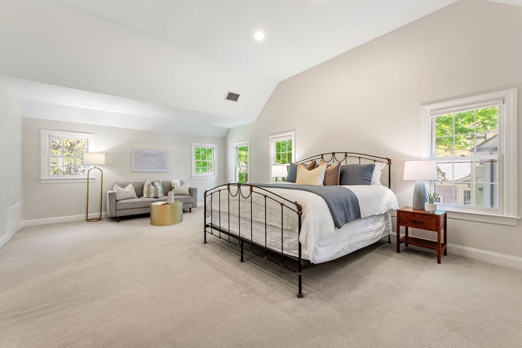 33 Bond Street Needham, MA 02492 - Photo 20 of 35 a bedroom with a bed couch and windows