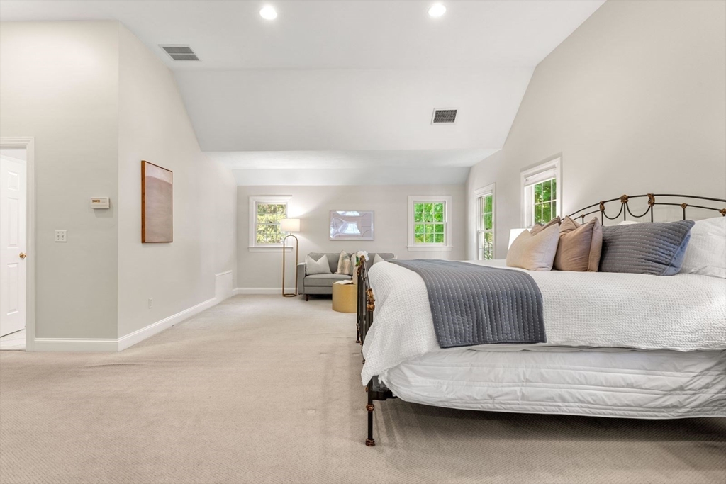 33 Bond Street Needham, MA 02492 - Photo 21 of 35 a bedroom with a bed couch and windows