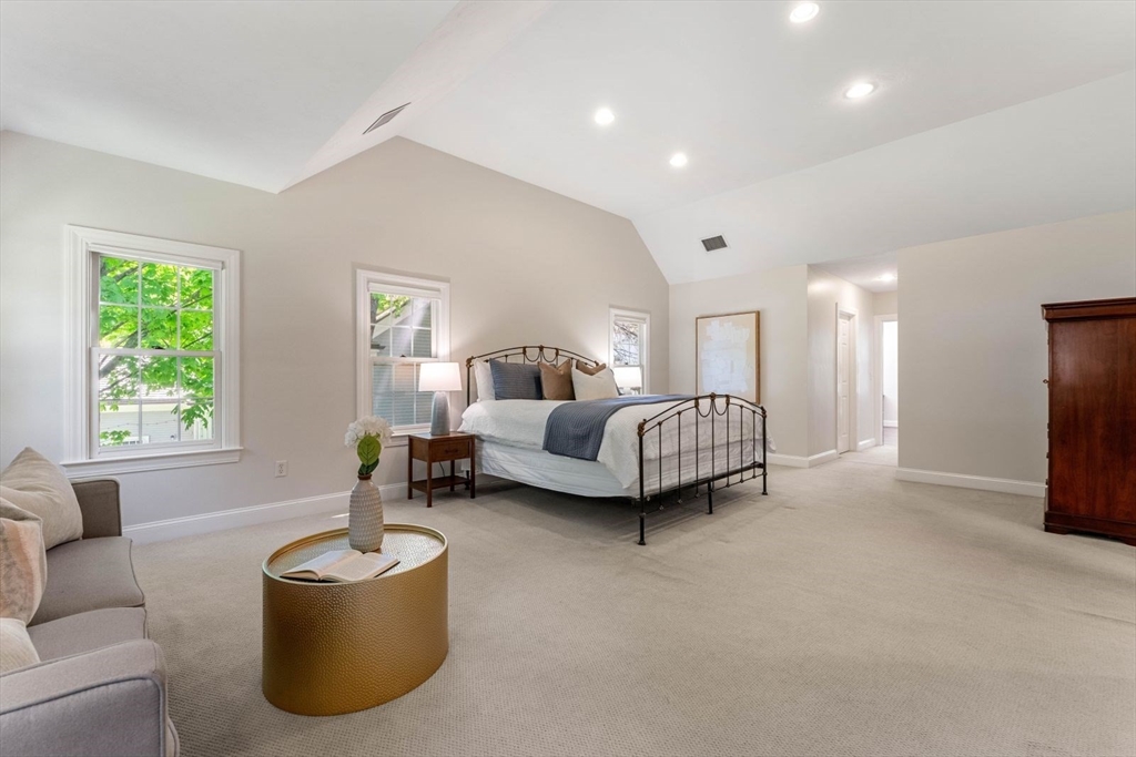 33 Bond Street Needham, MA 02492 - Photo 22 of 35 a bedroom with bed and a couch