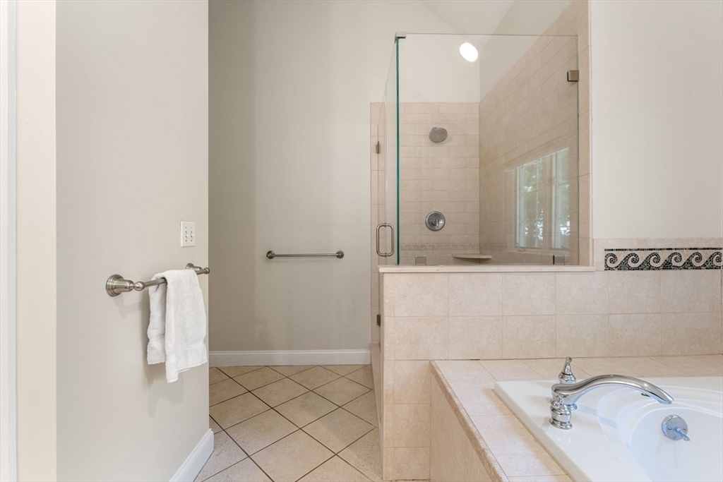 33 Bond Street Needham, MA 02492 - Photo 24 of 35 a bathroom with a tub sink and mirror