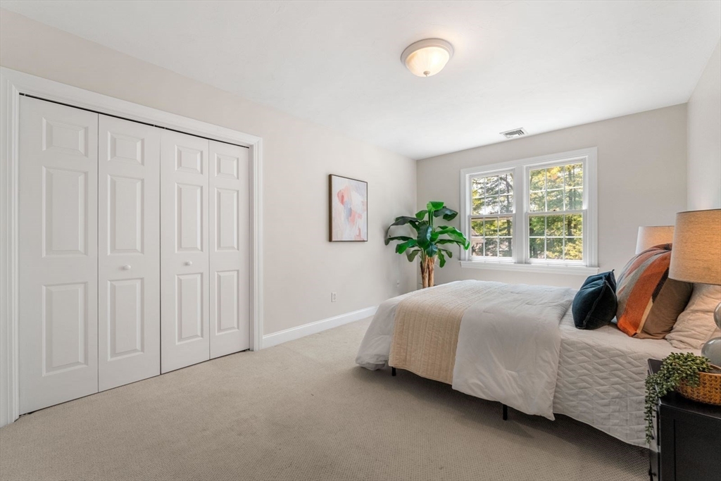 33 Bond Street Needham, MA 02492 - Photo 28 of 35 a bedroom with a bed and window