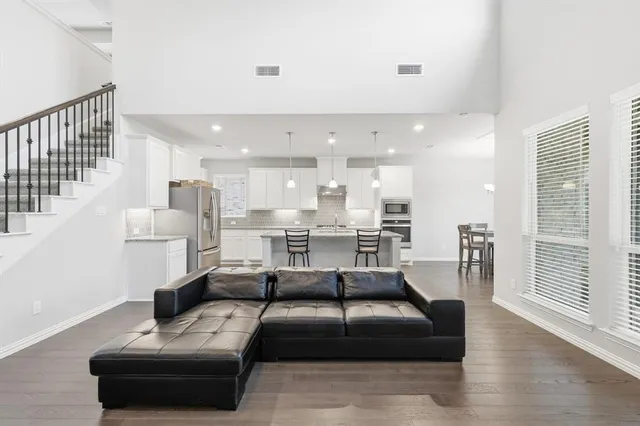 a living room with furniture and a table