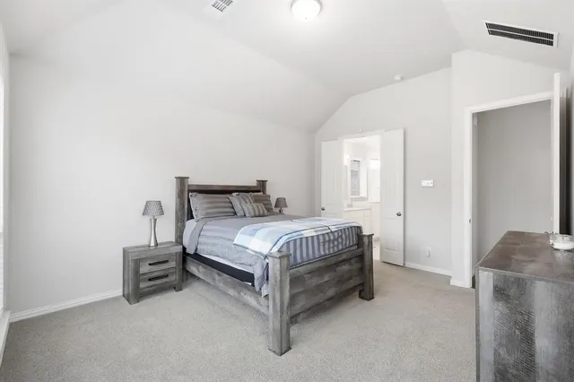 a bedroom with a bed and a couch