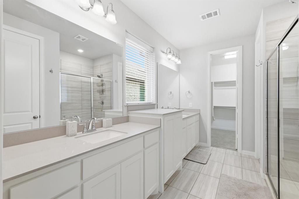 1708 Bird Cherry Lane Prosper, TX 75078 - Photo 15 of 32 a bathroom with a double vanity sink mirror and double
