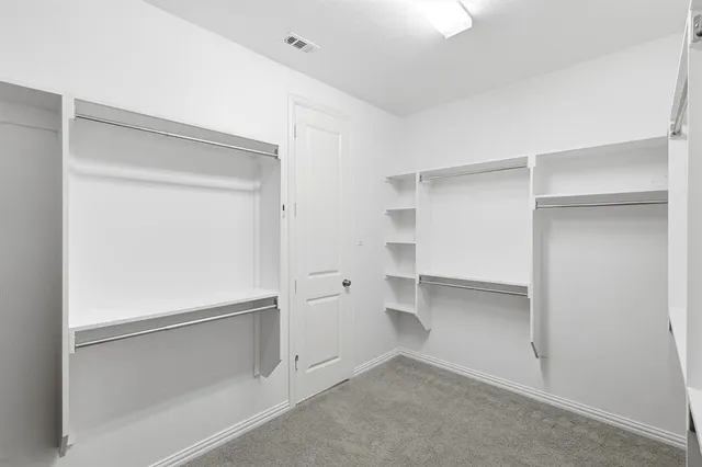 a view of an empty walk in closet