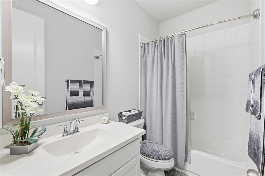 1708 Bird Cherry Lane Prosper, TX 75078 - Photo 20 of 32 a bathroom with a sink toilet and shower