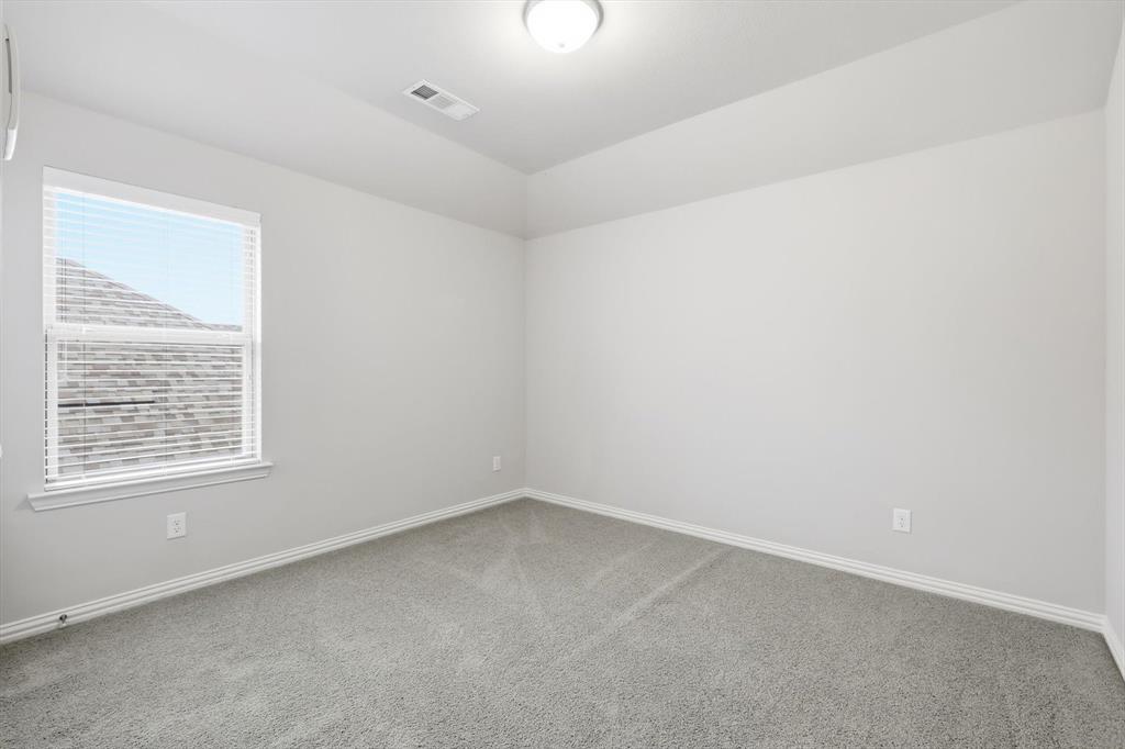 1708 Bird Cherry Lane Prosper, TX 75078 - Photo 21 of 32 an empty room with a window