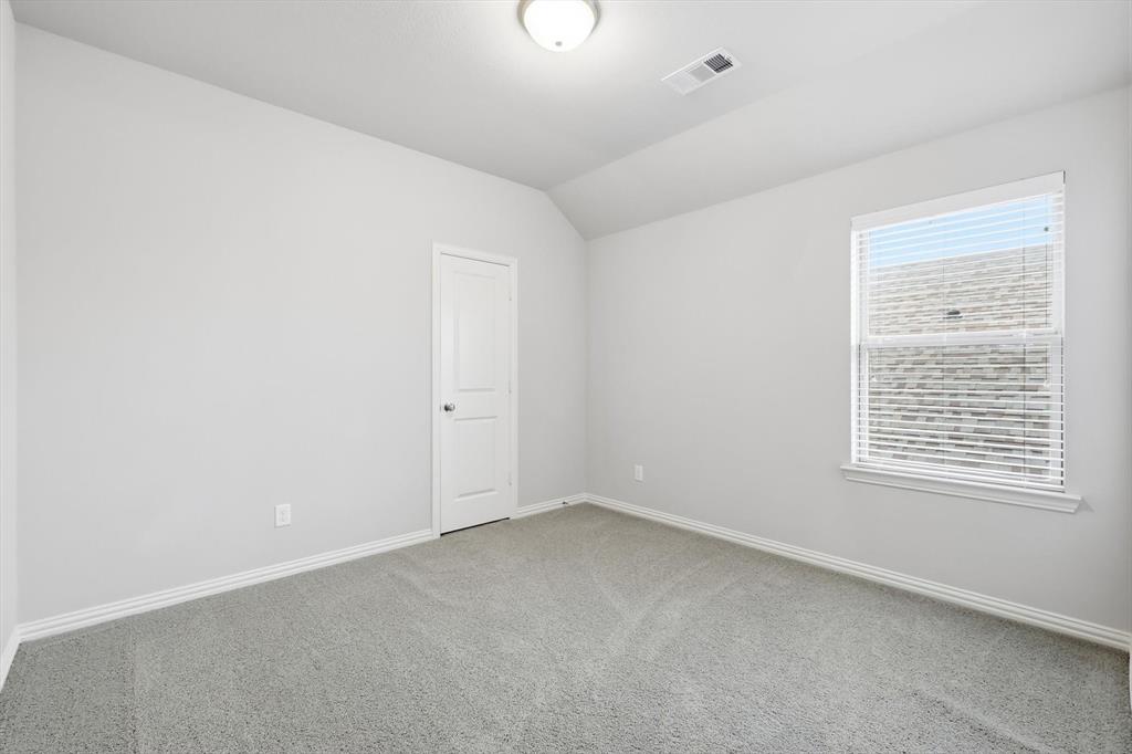 1708 Bird Cherry Lane Prosper, TX 75078 - Photo 22 of 32 an empty room with a window