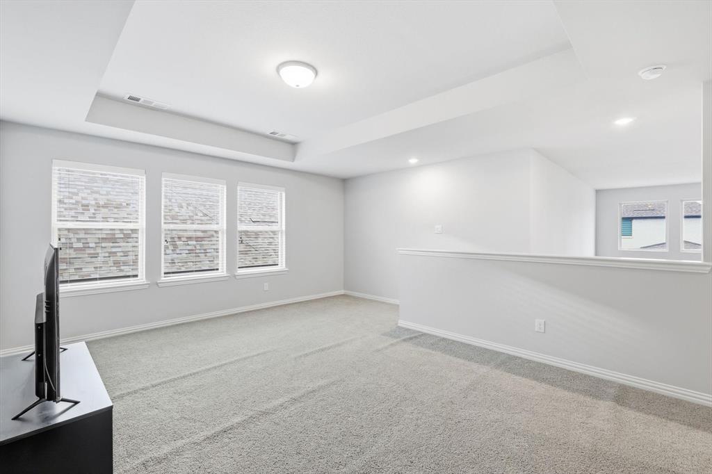 1708 Bird Cherry Lane Prosper, TX 75078 - Photo 26 of 32 a view of an empty room with a window