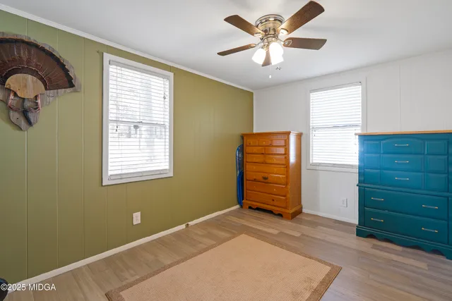 a bed room with a bed and a window