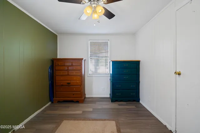 a bed room with a bed and a chandelier
