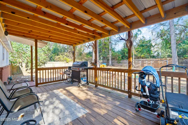 a view of a two chairs in the balcony