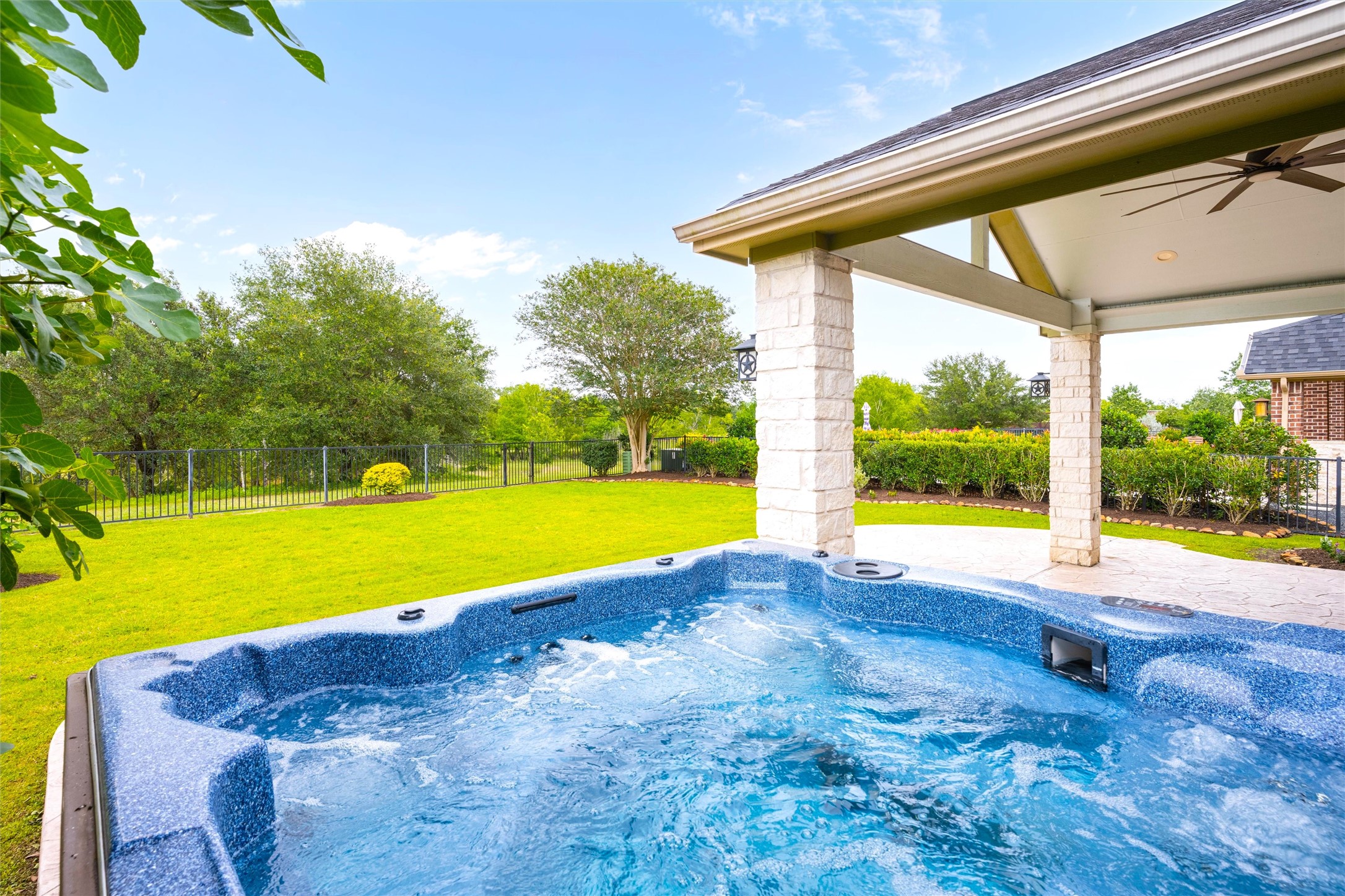 27714 Linden Ridge Lane Fulshear, TX 77441 - Photo 3 of 48 Relax in the hot tub, and enjoy nature with the creek of Creekside behind the home