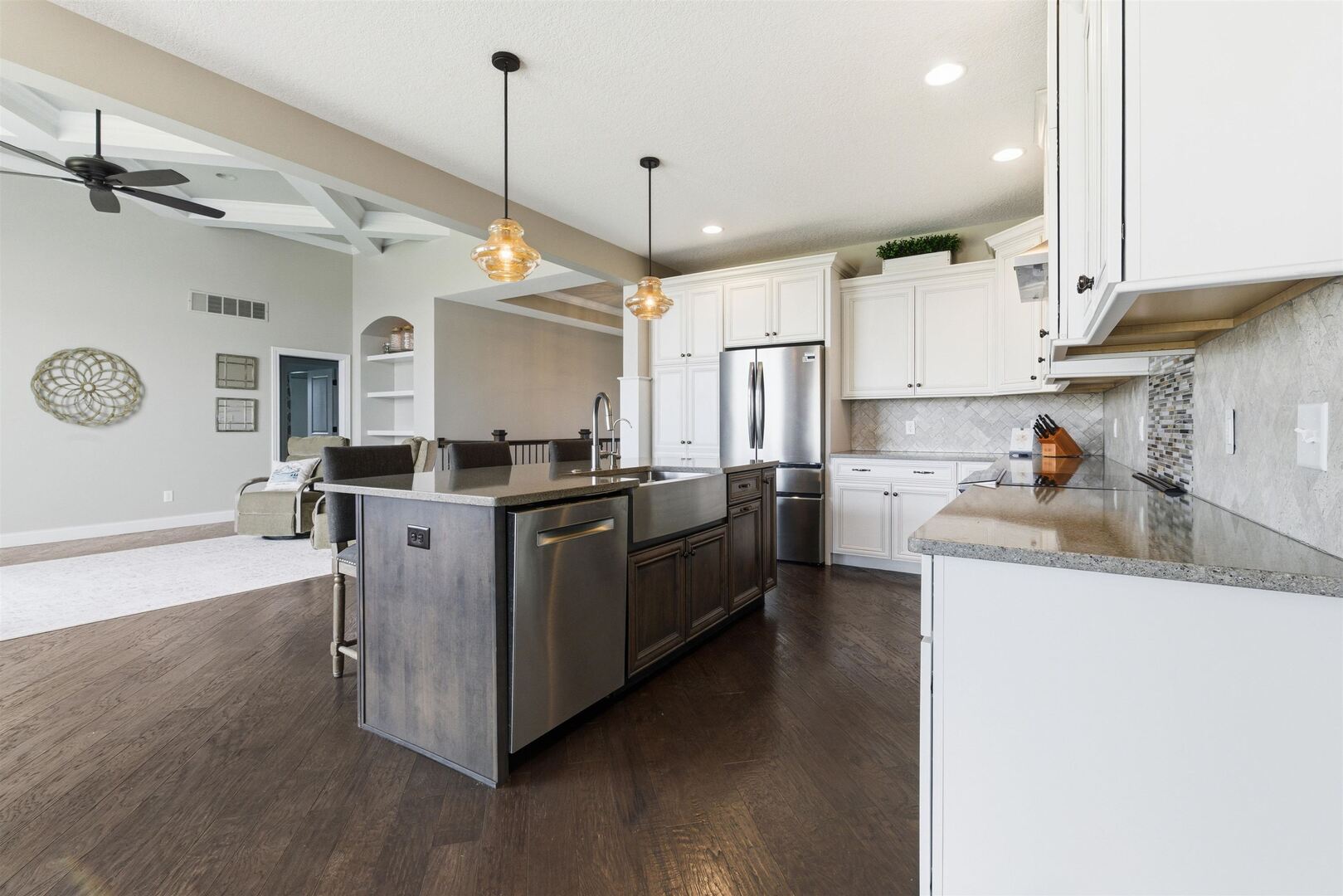 6478 Spring Creek Drive Bettendorf, IA 52722 - Photo 14 of 39 a kitchen with stainless steel appliances granite countertop a sink a stove and a wooden floors