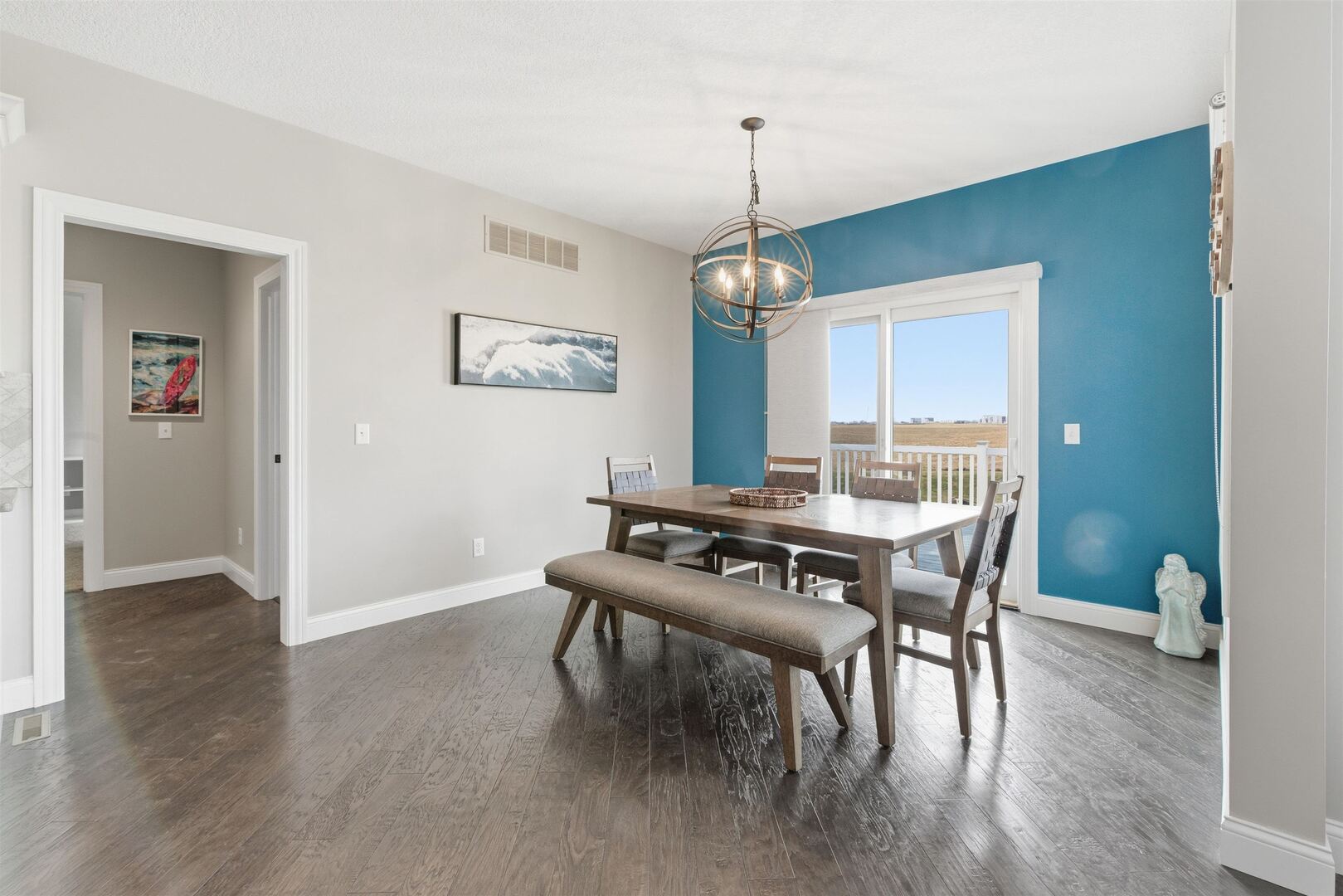 6478 Spring Creek Drive Bettendorf, IA 52722 - Photo 18 of 39 a view of a dining room with furniture window and wooden floor