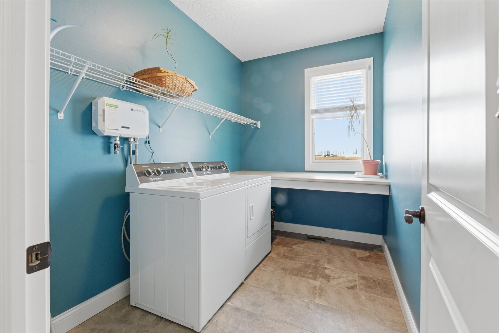 6478 Spring Creek Drive Bettendorf, IA 52722 - Photo 19 of 39 a utility room with a sink a washer and dryer